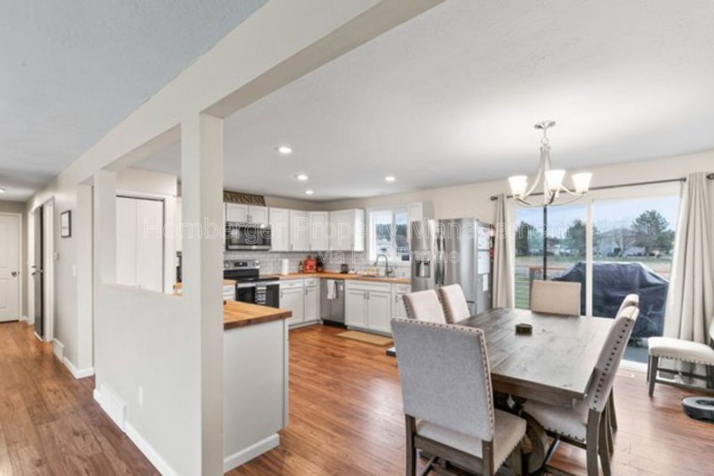Spacious 4 Bedroom Home with Two Family Rooms and Fenced Yard - Image 1
