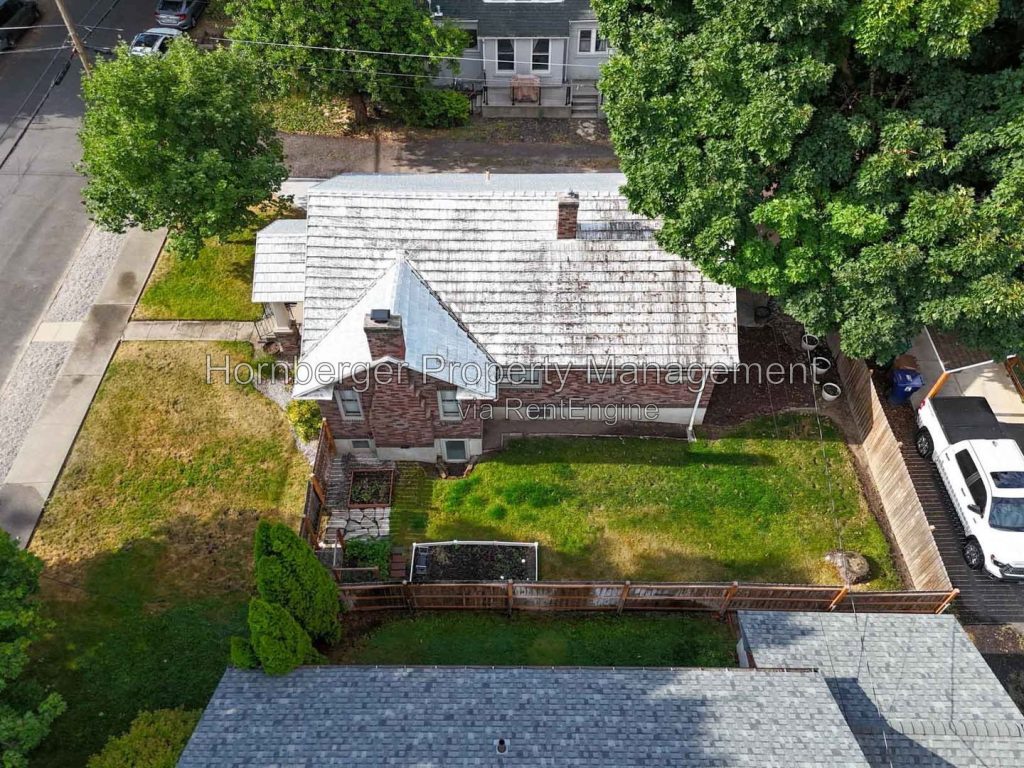 Spacious South Hill Home with Primary Suite and Beautiful Fenced Backyard - Image 3