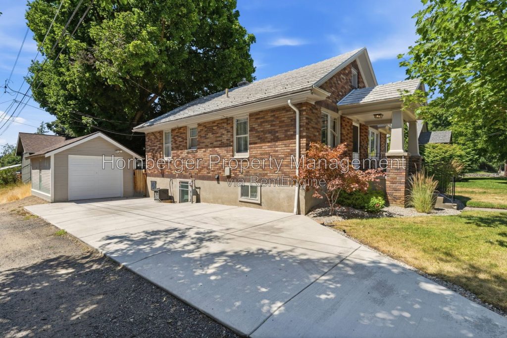 Spacious South Hill Home with Primary Suite and Beautiful Fenced Backyard - Image 2